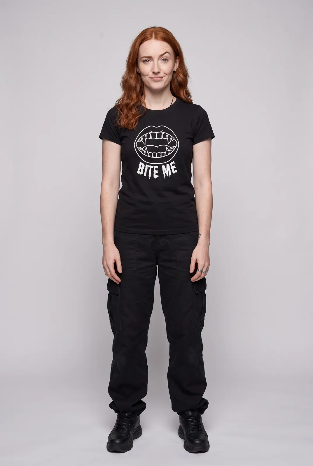 Maeve Gallagher wearing the BITE ME Tee in Black, front hero