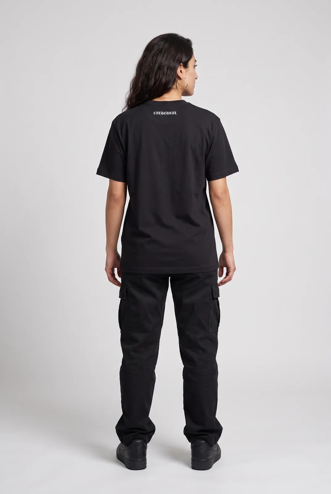 Amara Haddad wearing the CATHEDRAL Tee in Black, back turn
