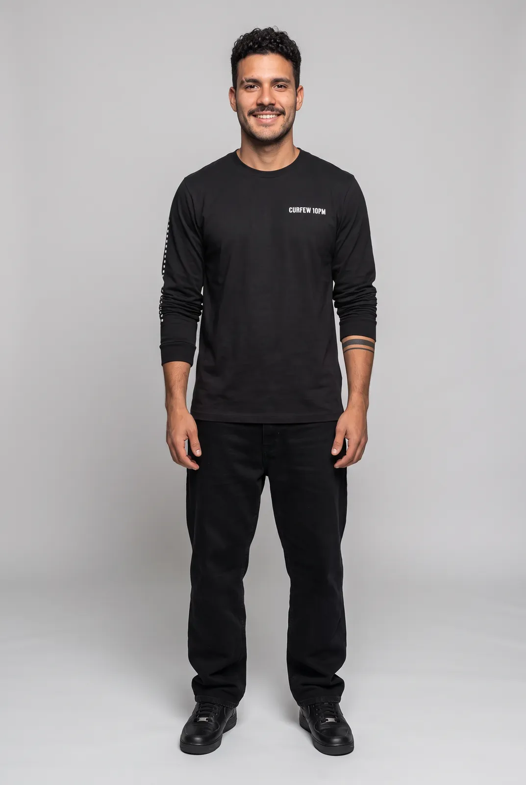 Diego Alvarez wearing the CURFEW Longsleeve in Black, front hero