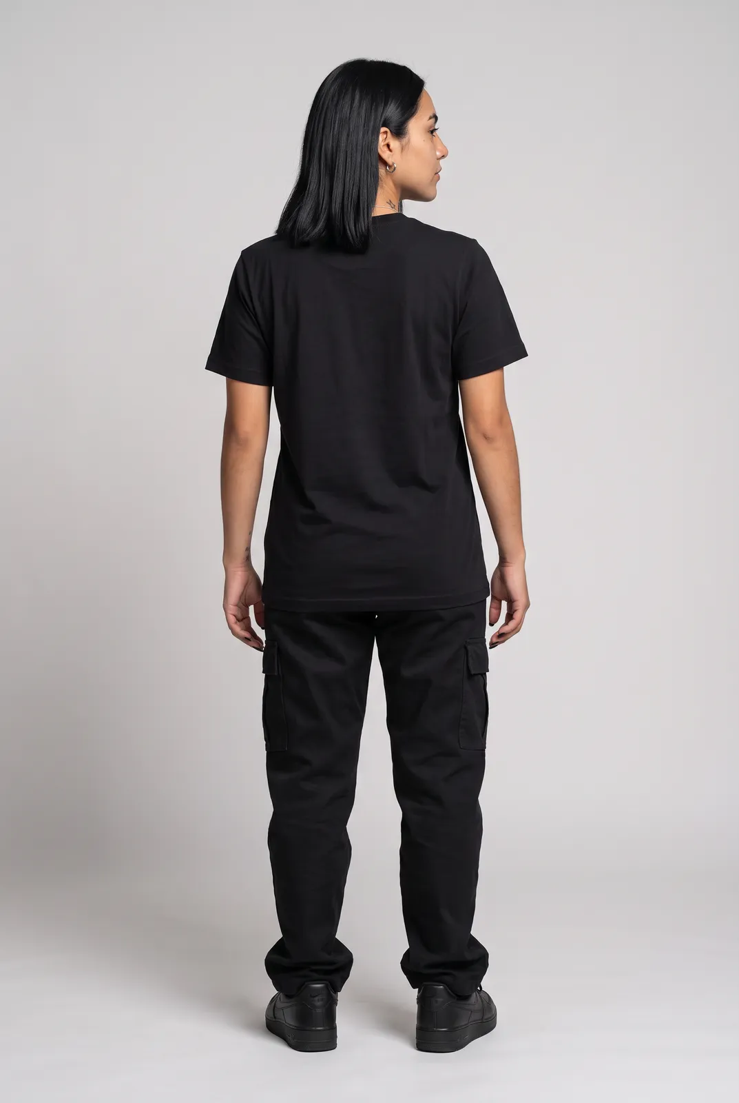 Nova Reyes wearing the DEAD MALL Tee in Black, back turn