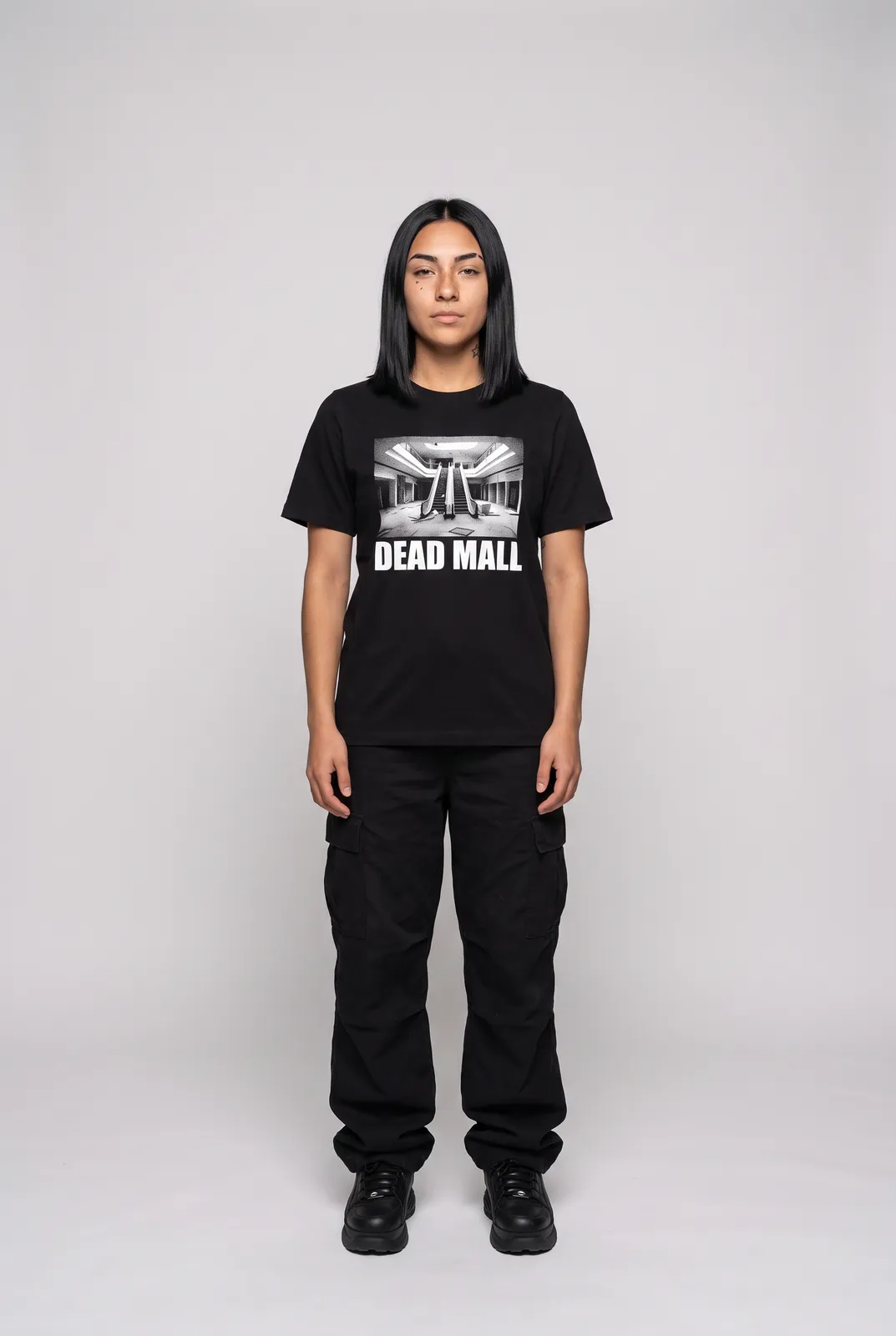 Nova Reyes wearing the DEAD MALL Tee in Black, front hero