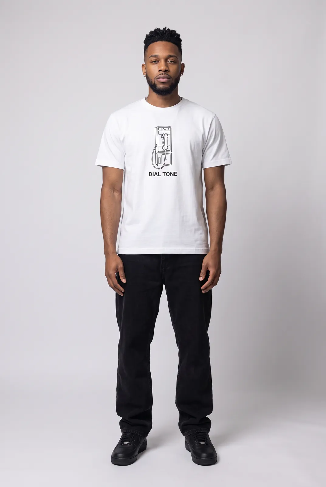 Malik Carter wearing the DIAL TONE Tee in White, front hero