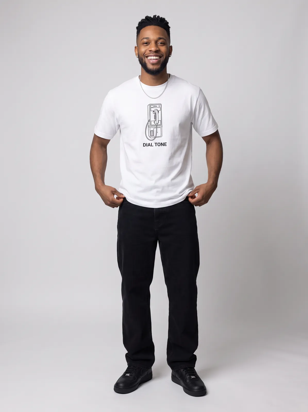 Malik Carter wearing the DIAL TONE Tee in White, waist up crop