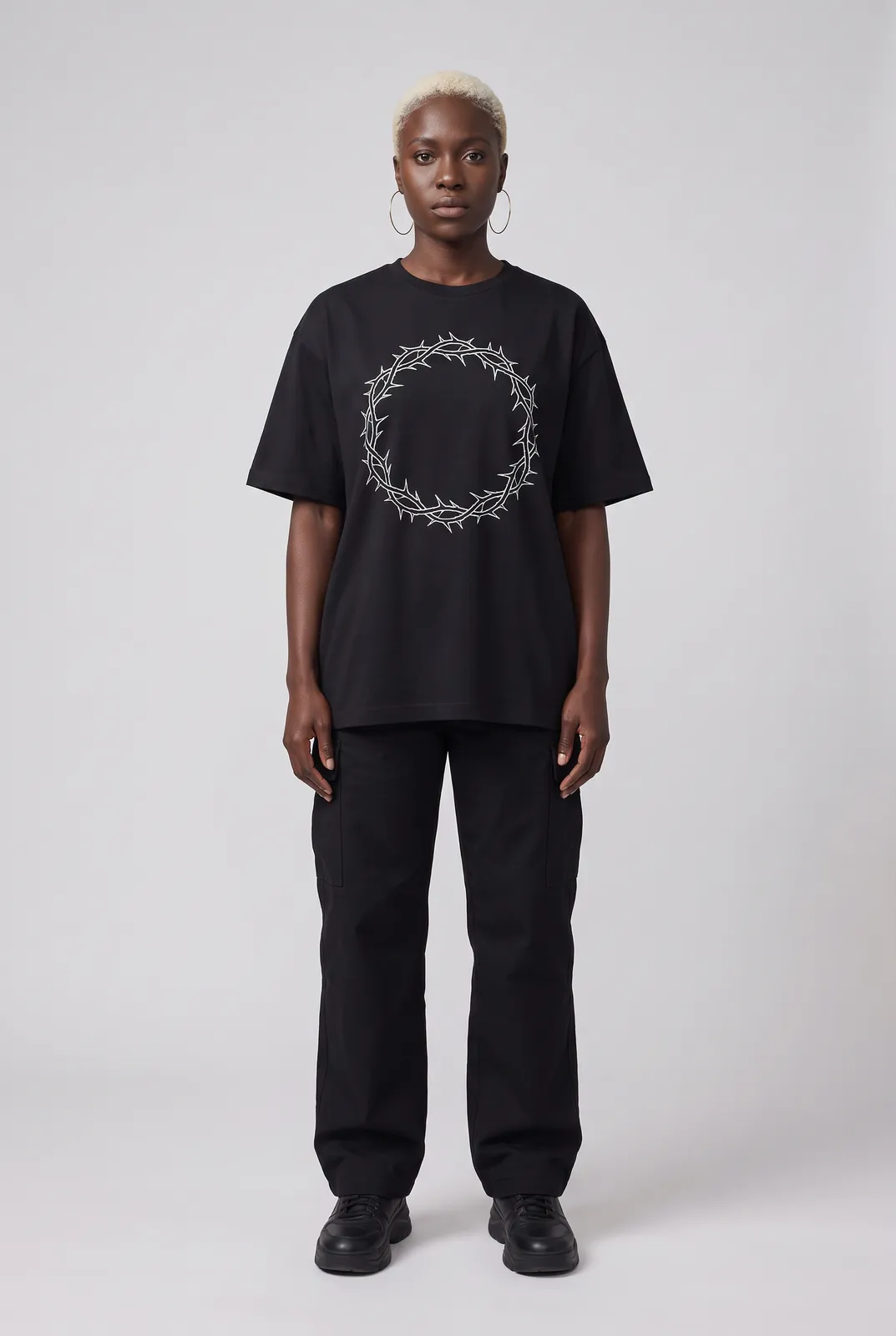 Imani Okafor wearing the HALO Oversized Tee in Black, front hero