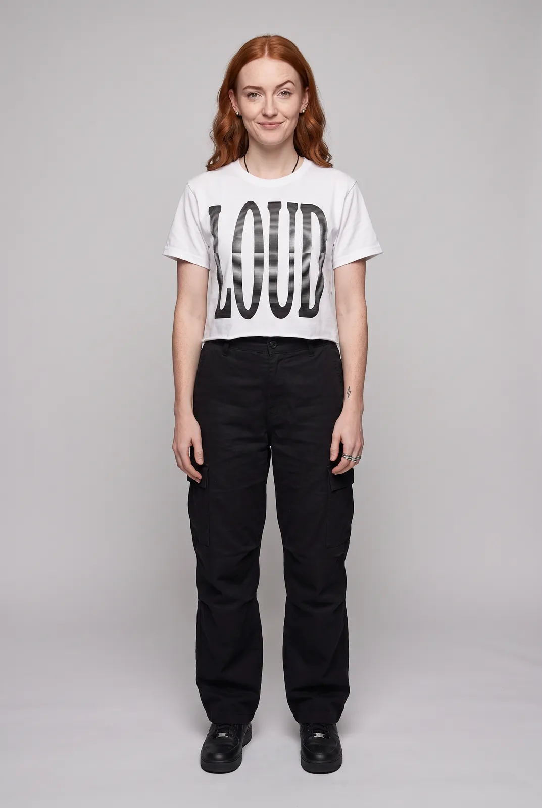 Maeve Gallagher wearing the LOUD Cropped Tee in White, front hero