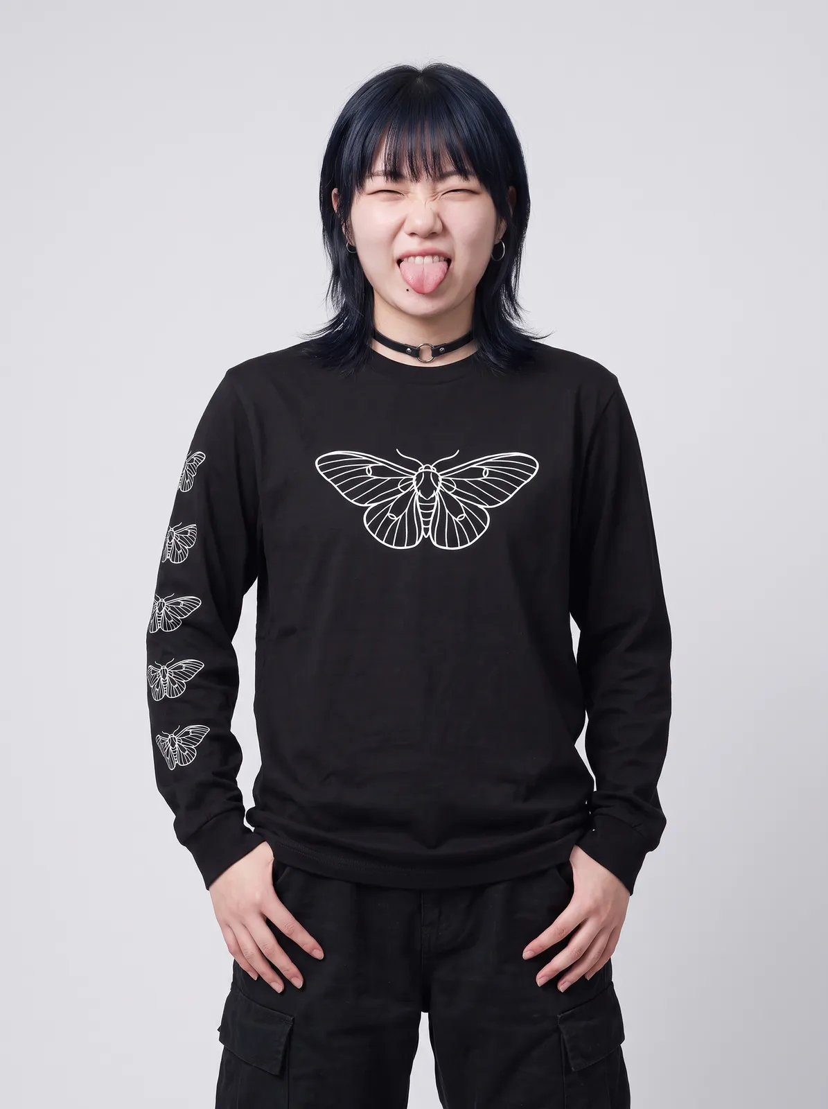 Sora Tanaka wearing the MOTH Longsleeve in Black, waist up crop