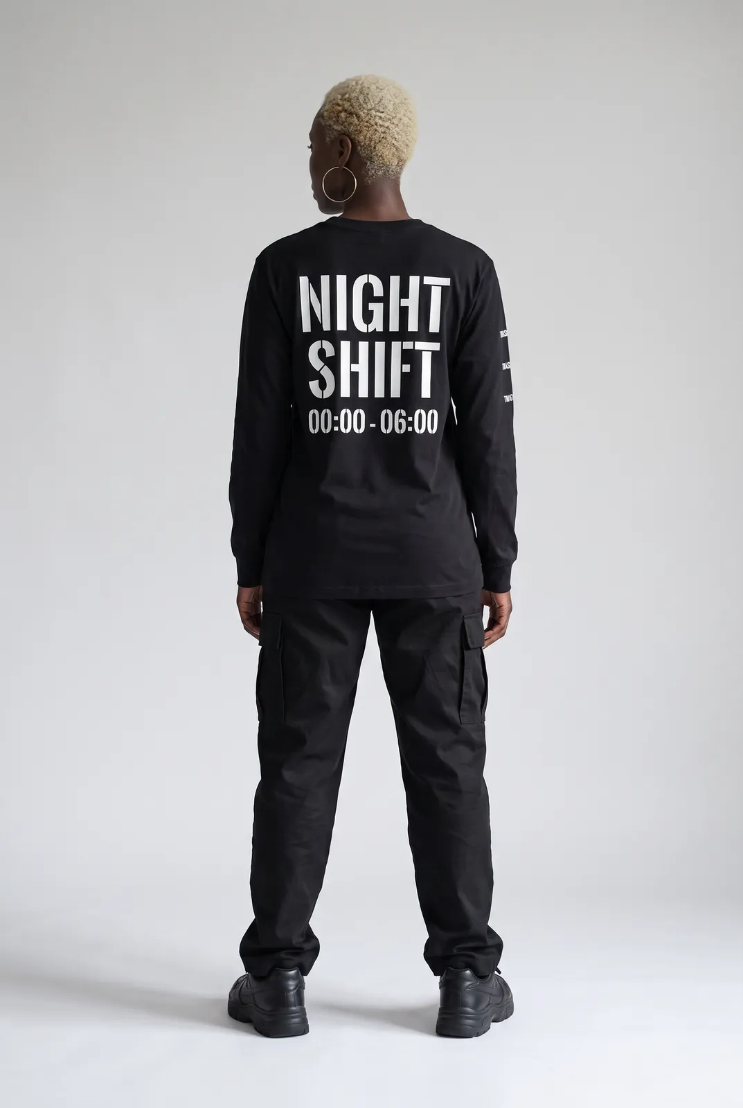 Imani Okafor wearing the NIGHT SHIFT Longsleeve in Black, back turn