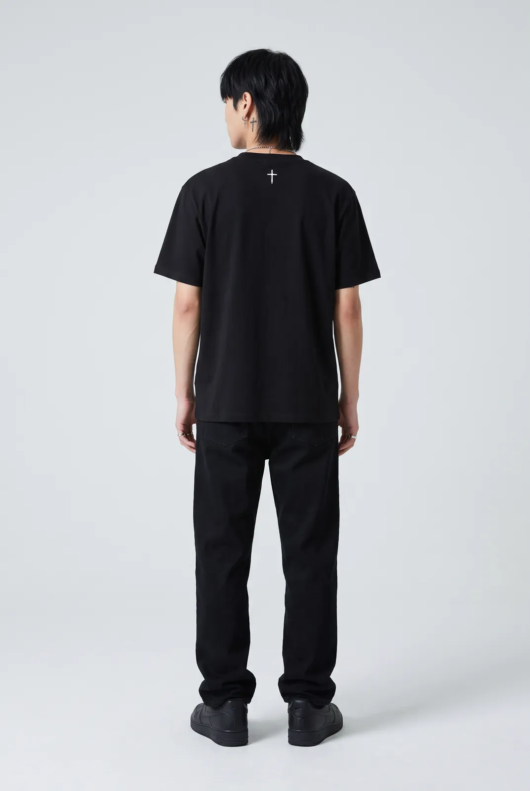 Jae Park wearing the SINNER Tee in Black, back turn
