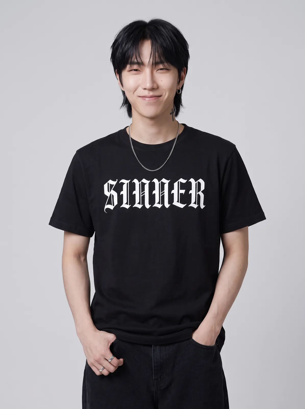 Jae Park wearing the SINNER Tee in Black, waist up crop